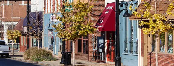 Belleville, IL a city street with brick buildings and a truck driving down it