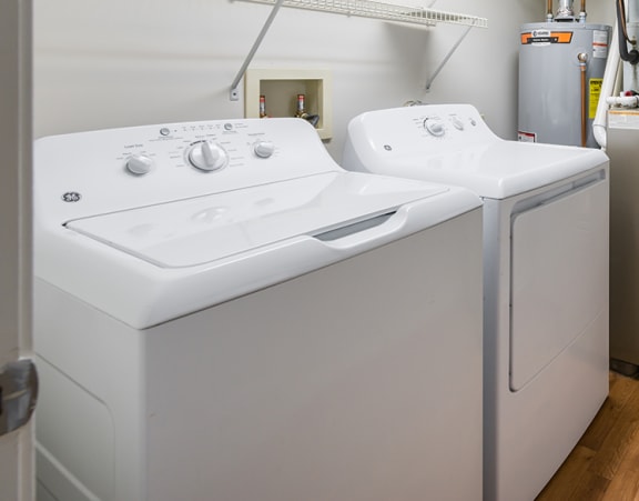 a laundry room with a washer and dryer at Duneland Village apartments and townhomes in Gary, IN