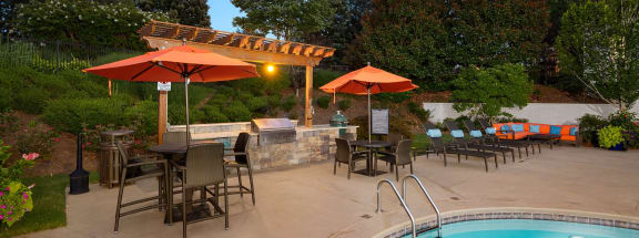 a patio with a pool and a pergola