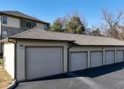 Thumbnail 27 of 30 - a 3 car garage with a house behind it