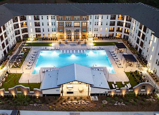 A large building with a pool in the middle of it.