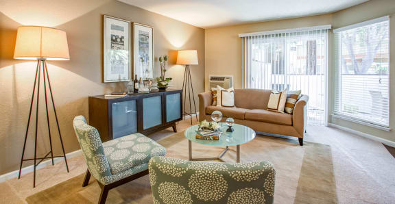 a living room with a couch and chairs at Valley Plaza Villages, California, 94566