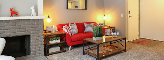 A living room with a fireplace and a couch.