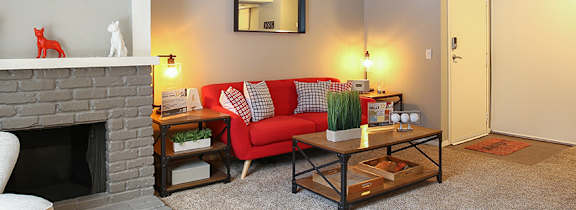 A living room with a fireplace and a couch.