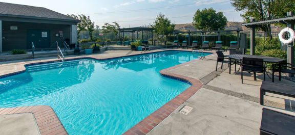 Riverpointe Apartments Pool with Lounge Chairs
