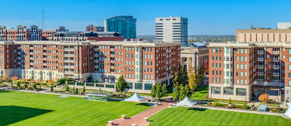 an aerial view of a park and the city