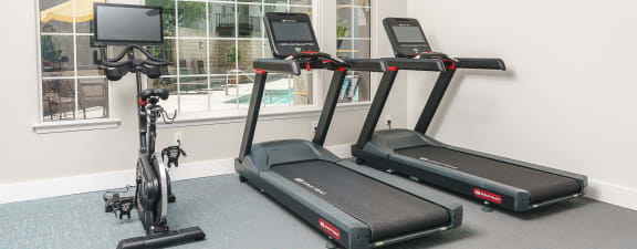 Fitness center with treadmill and stationary bike