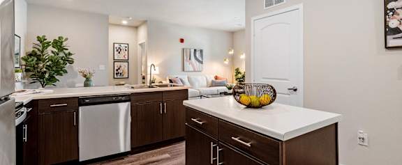 A kitchen with brown cabinets and a white countertop at Aventura at Wentzville I & II Apartments, Wentzville, 63385