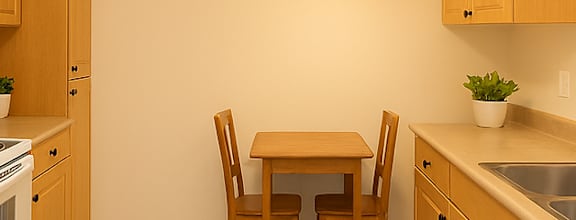 A modern dining room with a wooden table and chairs.