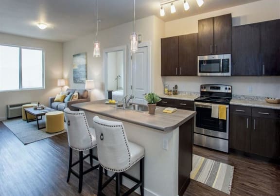 Talus Apartment Homes Model Kitchen and Living Room