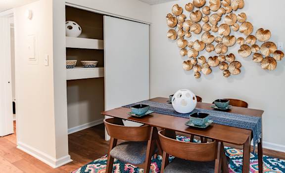 a dining room with a table and chairs