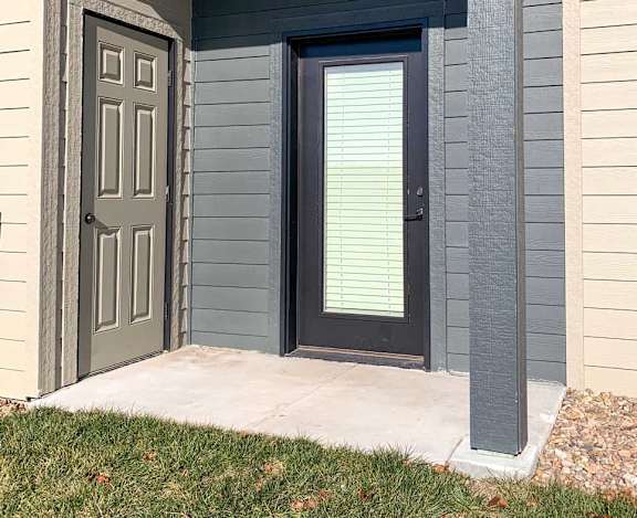 a patio with an outdoor storage closet