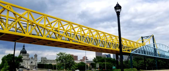 a close up of a yellow bridge over a street