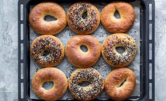 a tray of donuts on top of a black tray