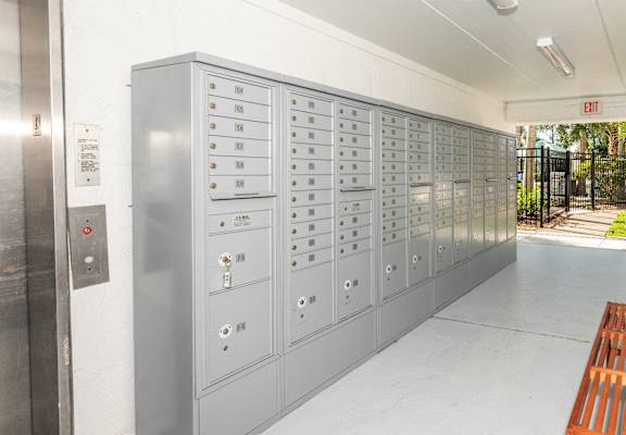 a locker room with a bench and some lockers at The Teale, Kissimmee, FL, 34746
