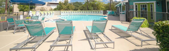 lounge chairs surrounding pool