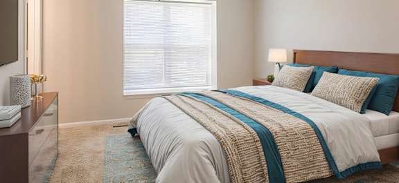 bedroom with window at longfellow heights apartments