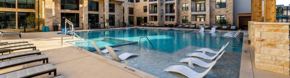 Maddox Hills Exterior and Pool with Lounge Chairs