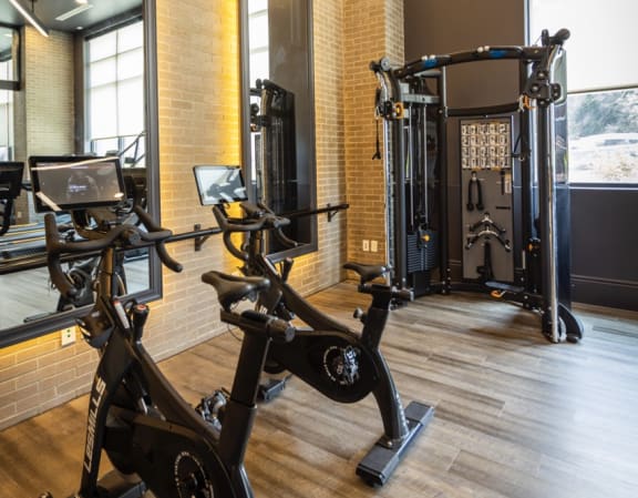 a room filled with lots of different types of exercise equipment