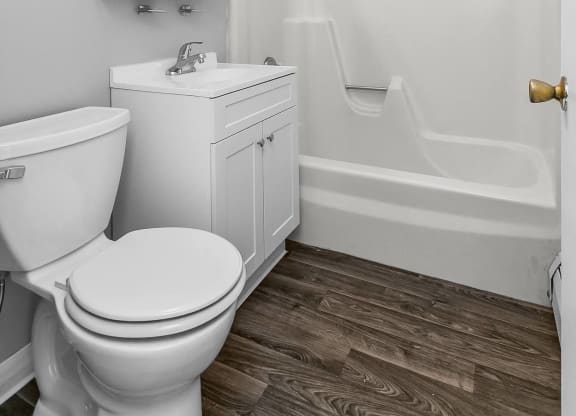 a bathroom with a toilet and a sink at Eagle Pointe New London, CT, 06320