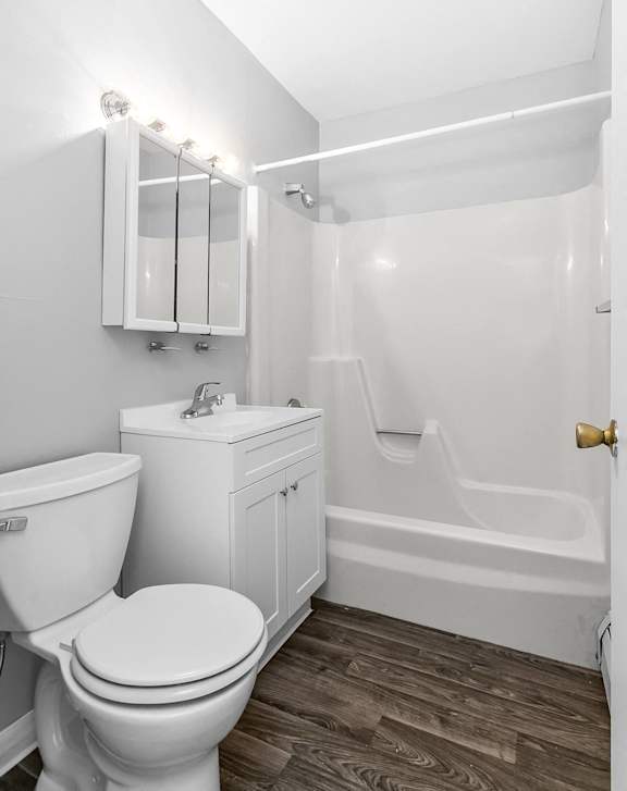 a bathroom with a toilet and a sink at Eagle Pointe New London, CT, 06320