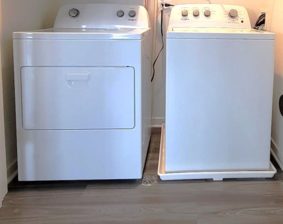 two washers and a dryer in a small room at Enclave Crystal Lake Townhomes and Apartments, Crystal Lake, 60014