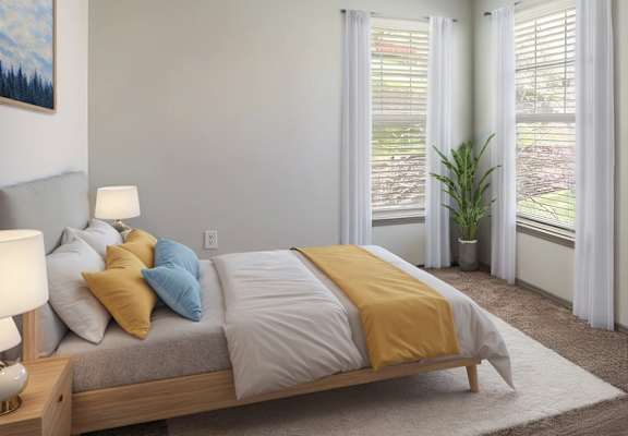 A bedroom with a bed, a lamp, and a painting on the wall.