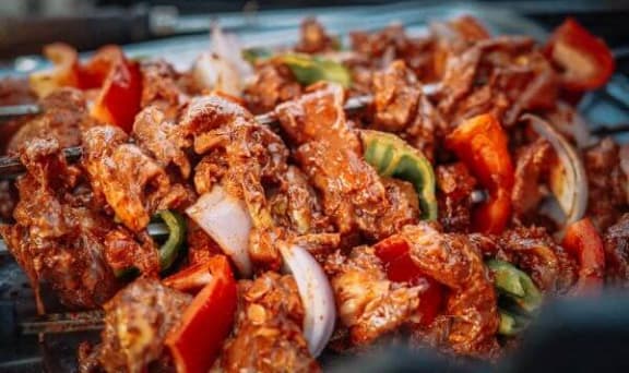 a plate of food with meat and vegetables