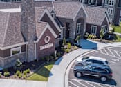 Thumbnail 2 of 53 - an aerial view of the community clubhouse with guest parking  at Waterside Residences on Quivira, Lenexa, Kansas