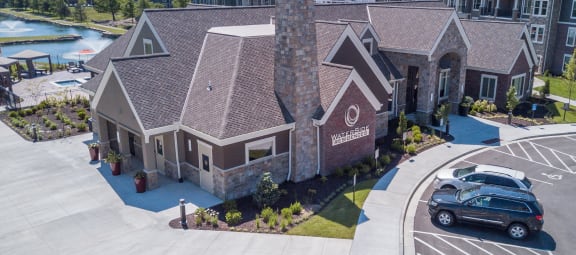 an aerial view of the community clubhouse with guest parking  at Waterside Residences on Quivira, Lenexa, Kansas