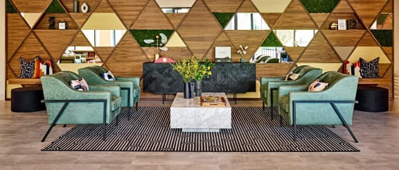 a lobby with couches and chairs and a table at Dey & Bergen, Harrison, 07029
