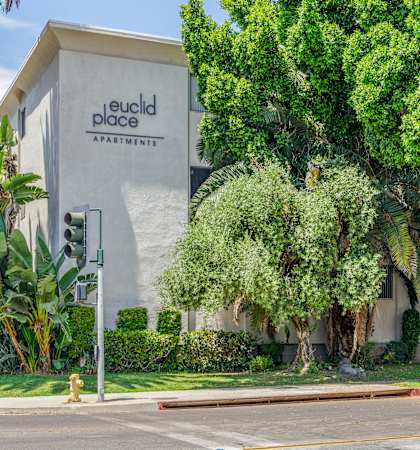 a building with a sign that says red dog apartments