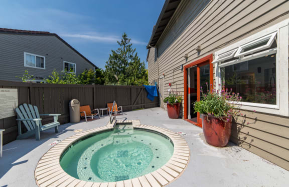 a small pool sits in the backyard of a house at Quartz Creek, Mountlake Terrace, WA, 98043