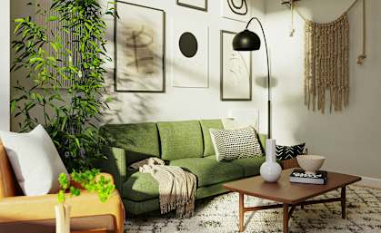 A living room with a green couch, a wooden coffee table, and a plant.