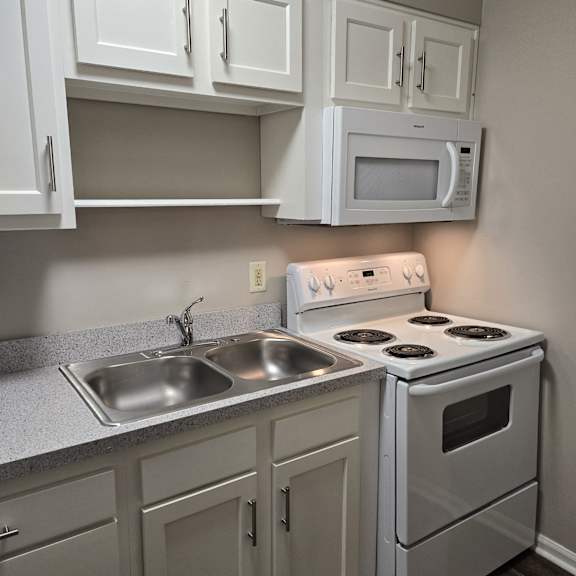 an overhead view of a laundry room with stacked washers and dryers