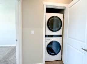 a washer and dryer in a closet in a home
