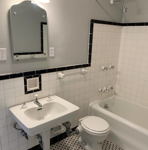 a bathroom with a sink toilet and a bath tub