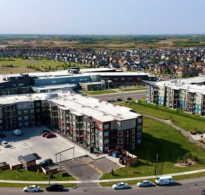 an aerial view of a city with buildings and a highway