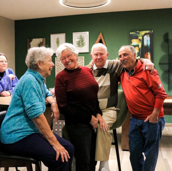 a group of people standing and sitting in a room at Vue at Bluestone, Minnesota