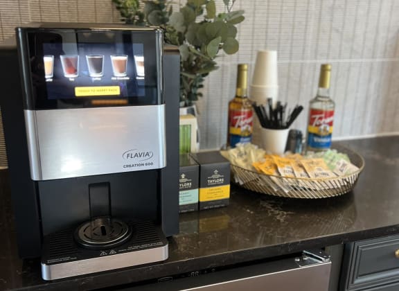 a coffee maker on a counter in a kitchen at The Depot, Raymore