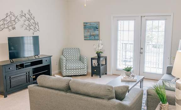a living room with a couch and a tv
