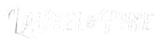 A black background with the words "Laurel & Pine" written in white cursive font.