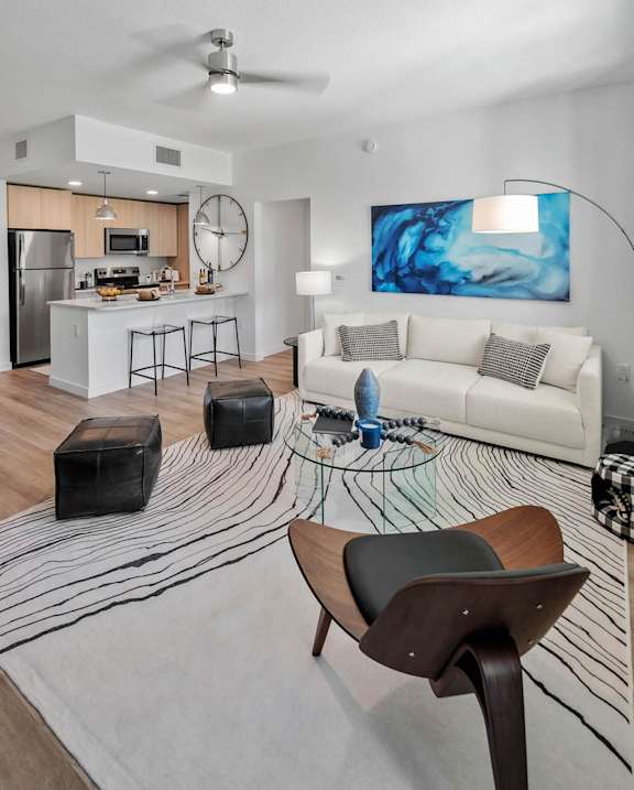 a living room with a couch and a table at Altis Blue Lake, Lake Worth, FL, 33467