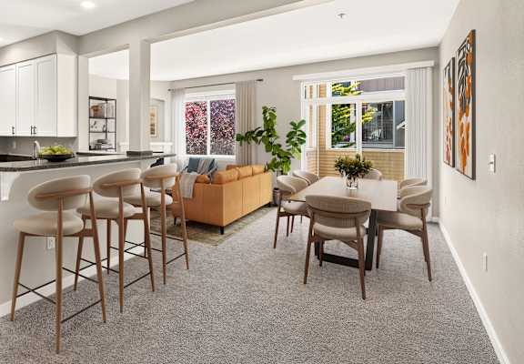 A modern kitchen with a bar area and a dining table.
