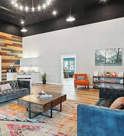 a living room with couches and chairs and a table  at Emerald Bay, Charlotte, North Carolina