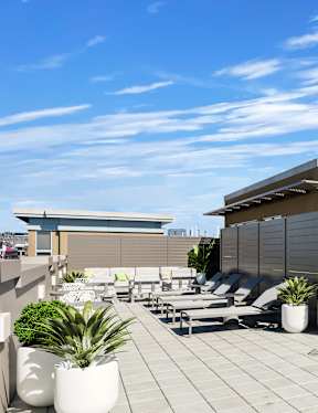 Rooftop with umbrella and patio at The DeSoto Apartments Building in Washington, DC 20005