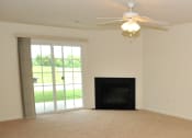 Thumbnail 11 of 32 - Gas fireplace, living room with ceiling fan