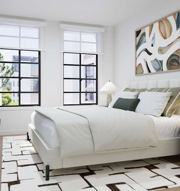 A bedroom with a large bed and a painting on the wall.