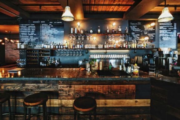a bar with bar stools in a bar