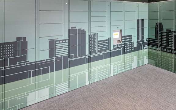 a mural of a city skyline is painted on the wall of a room